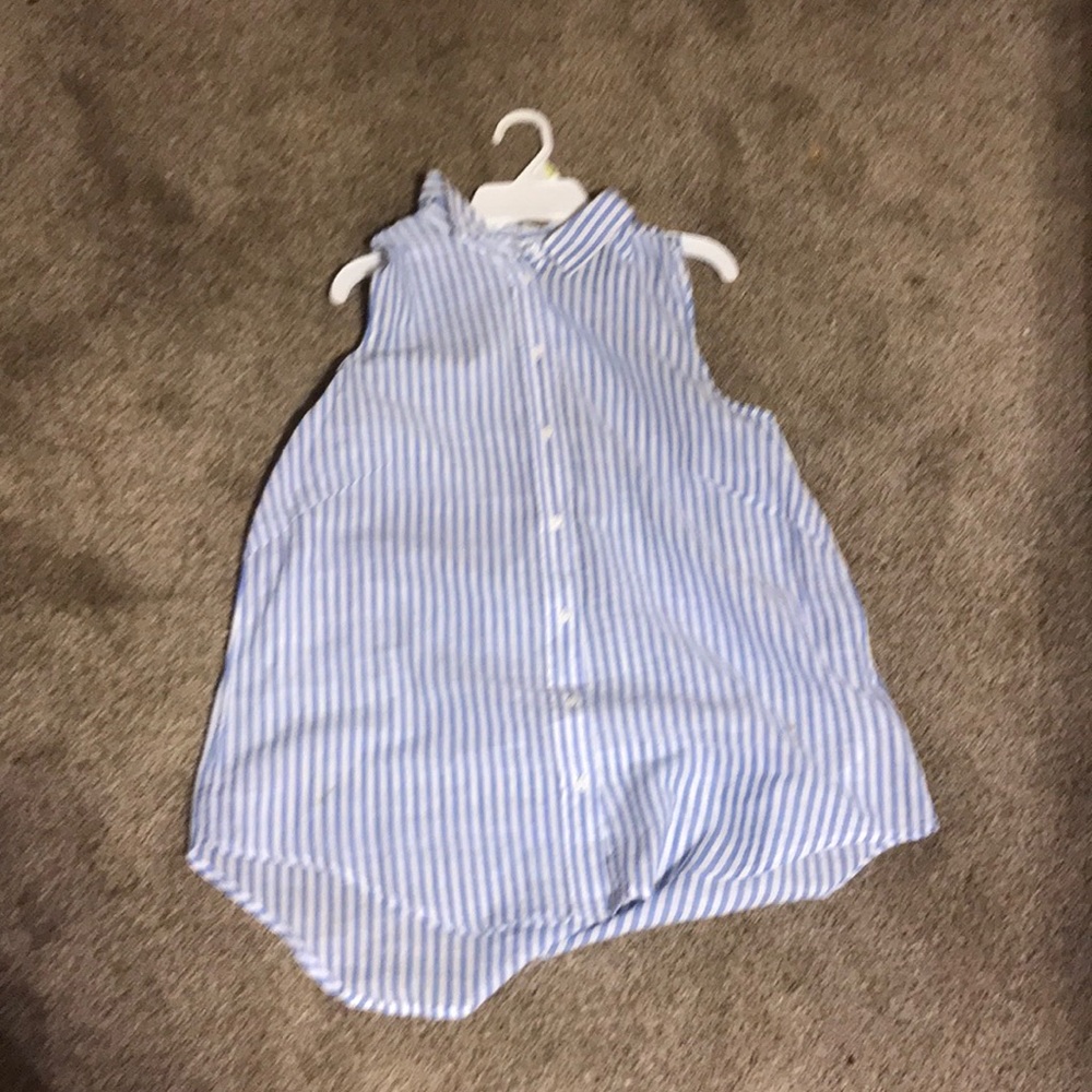 A blue and white sleeveless blouse